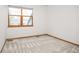 Bedroom featuring white walls, neutral carpet, and window with blind at 6506 S Robb Way, Littleton, CO 80127