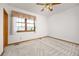 Bedroom featuring white walls, neutral carpet, and a window at 6506 S Robb Way, Littleton, CO 80127
