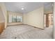 Spacious bonus room featuring neutral carpet and a bright window at 6506 S Robb Way, Littleton, CO 80127