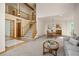 Open-concept living area with a staircase, dining area, and view to the second floor at 6506 S Robb Way, Littleton, CO 80127