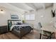 Charming bedroom with a large bed, desk, and chair, perfect for relaxation and productivity at 655 N Pearl St # 301, Denver, CO 80203