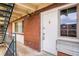 Close-up of apartment entrance, featuring a secure white door and tidy exterior at 655 N Pearl St # 301, Denver, CO 80203
