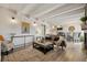 Bright living room with beamed ceilings flows into kitchen and dining room at 655 N Pearl St # 301, Denver, CO 80203