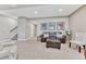 Comfortable basement with plush carpet, a cozy seating area, and convenient access to the staircase at 6930 Hyland Hills St, Castle Pines, CO 80108