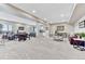 Spacious basement with an open floorplan, featuring a bar, game area, and cozy seating area at 6930 Hyland Hills St, Castle Pines, CO 80108