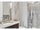 Modern bathroom featuring a glass-enclosed shower, granite countertop vanity, and neutral decor at 6930 Hyland Hills St, Castle Pines, CO 80108