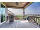 Inviting covered deck with a grill, offering a perfect space for outdoor cooking and relaxation at 6930 Hyland Hills St, Castle Pines, CO 80108