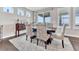 Bright dining room featuring a large window, elegant furnishings, and outdoor views at 6930 Hyland Hills St, Castle Pines, CO 80108