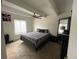 Bedroom featuring ceiling fan, neutral carpet, and ample natural light at 9995 E Harvard Ave # 177, Denver, CO 80231
