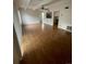 Open-concept living room with hardwood floors and access to the kitchen area at 9995 E Harvard Ave # 177, Denver, CO 80231