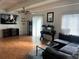 Cozy living room with laminated floors, ceiling fan, and ample natural light at 9995 E Harvard Ave # 177, Denver, CO 80231
