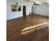 View of the open living space leading to the kitchen with stainless steel appliances at 9995 E Harvard Ave # 177, Denver, CO 80231