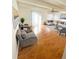 Bright living room with hardwood floors, and large windows providing ample natural light at 9995 E Harvard Ave # 177, Denver, CO 80231