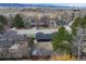 Aerial view of the home, with landscaping and houses on the street at 7476 Park Lane Rd, Longmont, CO 80503