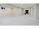 Expansive basement with neutral carpet, recessed lighting, and open floor plan at 7476 Park Lane Rd, Longmont, CO 80503