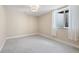 Cozy room with neutral walls, soft carpet and natural light from the window at 7476 Park Lane Rd, Longmont, CO 80503