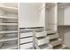 Custom walk-in closet features built in shelving and plenty of storage space at 7476 Park Lane Rd, Longmont, CO 80503