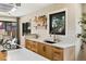 Modern kitchen features a black undermount sink, wood cabinets, and bright white countertops at 7476 Park Lane Rd, Longmont, CO 80503