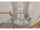 Spacious foyer viewed from above, featuring a tile floor, chandelier, and front door at 18003 E Alamo Dr, Centennial, CO 80015