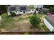 Aerial view of spacious backyard with mature trees, play set and solar panels on home at 19258 E Kansas Dr, Aurora, CO 80017