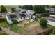 Aerial view of spacious backyard with mature trees, play set and solar panels on home at 19258 E Kansas Dr, Aurora, CO 80017