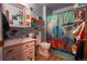Colorful bathroom with shower/tub combo, unique décor, and plenty of storage at 19258 E Kansas Dr, Aurora, CO 80017