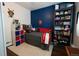 Well decorated bedroom with a dark accent wall and ample space for relaxation and personalization at 19258 E Kansas Dr, Aurora, CO 80017