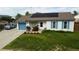 Charming single-Gathering home boasting a well-manicured lawn, solar panels, and a freshly painted garage at 19258 E Kansas Dr, Aurora, CO 80017
