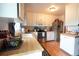 Well-lit kitchen features stainless steel appliances, butcher block countertops, and white cabinetry at 19258 E Kansas Dr, Aurora, CO 80017