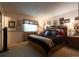 Spacious main bedroom features carpet floors, large window, and a king size bed at 19258 E Kansas Dr, Aurora, CO 80017