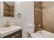 This bathroom features a sleek vanity, modern fixtures, and a tiled shower and tub combination at 2306 Glenarm Pl # 206, Denver, CO 80205