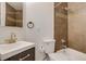 Updated bathroom with brown tile and modern vanity at 2306 Glenarm Pl # 206, Denver, CO 80205