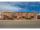 A row of apartments with brick exteriors is situated along a city street at 2306 Glenarm Pl # 206, Denver, CO 80205
