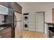 Modern kitchen with stainless steel appliances and in-unit laundry at 2306 Glenarm Pl # 206, Denver, CO 80205