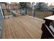 Spacious wooden deck with railing, comfortable seating, and an inviting outdoor space at 5973 S Krameria St, Centennial, CO 80111