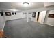 Spacious basement with gray carpet, light gray walls, recessed lighting, and artistic accents at 5973 S Krameria St, Centennial, CO 80111