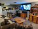 Comfortable basement living area featuring plush seating, entertainment center, and ample storage at 5973 S Krameria St, Centennial, CO 80111