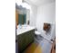 Stylish bathroom with green vanity, modern fixtures, and tiled flooring for a clean look at 5973 S Krameria St, Centennial, CO 80111