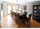 Dining room with hardwood floors, elegant table, chairs, and natural light at 5973 S Krameria St, Centennial, CO 80111