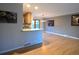 Bright and airy living area with hardwood floors, open to the kitchen area at 5973 S Krameria St, Centennial, CO 80111