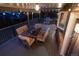 Outdoor deck featuring ample seating with colorful cushions, a dining table, grill, and string lights at 5973 S Krameria St, Centennial, CO 80111