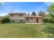 Expansive backyard with well-maintained lawn and back patio area for entertaining and outdoor enjoyment at 2453 S Memphis Way, Aurora, CO 80013