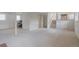 Spacious finished basement with neutral carpet, ample lighting, and a cozy atmosphere at 2453 S Memphis Way, Aurora, CO 80013