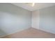 Cozy bedroom featuring a ceiling fan, neutral walls, carpeted floor, and closet with sliding doors at 2453 S Memphis Way, Aurora, CO 80013