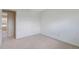 This bedroom features neutral walls, carpeted floor, and an open doorway at 2453 S Memphis Way, Aurora, CO 80013