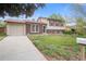 Charming two-story home with a well-kept lawn, brick accents, and an attached garage at 2453 S Memphis Way, Aurora, CO 80013