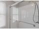 This bathroom showcases an updated shower with glass doors and white subway tile surround at 2453 S Memphis Way, Aurora, CO 80013