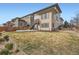 Spacious backyard with patio area, landscaping, and well-maintained lawn at 14734 Domino Dr, Parker, CO 80134