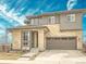 Two-story home with brick and siding, attached two car garage, and professionally landscaped yard at 14734 Domino Dr, Parker, CO 80134