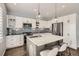 Bright kitchen with stainless steel appliances, subway tile backsplash, and island with seating at 14734 Domino Dr, Parker, CO 80134